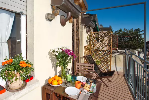 Table set for breakfast on the terrace of Milan Skyline Apartment, Milan Città Studi