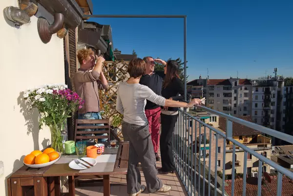 Terrace of Milan Skyline Apartment with people in the sun