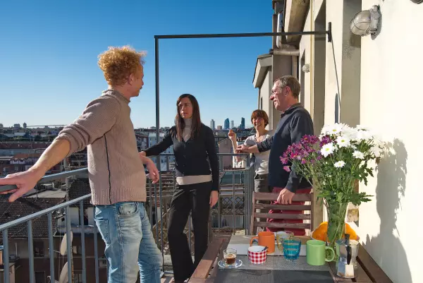 Four friends on the terrace of Milan Skyline Apartment, Milan Città Studi